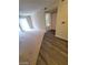 Spacious living room featuring sliding glass doors to let in natural light and new laminate flooring at 555 E Silverado Ranch Blvd # 1123, Las Vegas, NV 89183