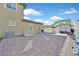 Spacious backyard with brick pavers, lawn, shed, and outdoor equipment at 625 Honesty Ct, Henderson, NV 89011