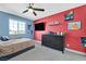 Bedroom with large window, TV, ceiling fan, and two-tone color scheme at 625 Honesty Ct, Henderson, NV 89011