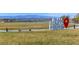 Scenic community park featuring a pond, open space, and welcoming signage at 625 Honesty Ct, Henderson, NV 89011