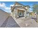 Charming facade with stone accents, covered porch, and manicured landscaping at 625 Honesty Ct, Henderson, NV 89011