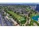 Aerial view of community with golf course, pool, and landscaping at 669 Oakmont Ave # 3709, Las Vegas, NV 89109