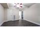 Bright bedroom with ceiling fan, wood look floors, and access to bathroom at 669 Oakmont Ave # 3709, Las Vegas, NV 89109