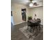 Cozy dining area features dark wood table, area rug, and view into kitchen at 669 Oakmont Ave # 3709, Las Vegas, NV 89109