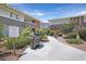 Outdoor community barbecue area with landscaped walkway and common areas at 669 Oakmont Ave # 3709, Las Vegas, NV 89109