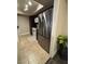 Efficient kitchen with dark wood cabinets, stainless refrigerator, and tile flooring at 669 Oakmont Ave # 3709, Las Vegas, NV 89109