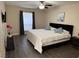 Main bedroom featuring modern fixtures, wood look floors, and large window at 669 Oakmont Ave # 3709, Las Vegas, NV 89109