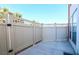 Private outdoor patio area with a light-colored fence and a concrete floor, perfect for outdoor relaxation and enjoyment at 669 Oakmont Ave # 3709, Las Vegas, NV 89109