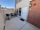 Outdoor patio featuring seating and a grill, perfect for entertaining with convenient access to the unit's entrance at 669 Oakmont Ave # 3709, Las Vegas, NV 89109