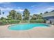 Outdoor community pool with landscaped surroundings and seating at 669 Oakmont Ave # 3709, Las Vegas, NV 89109