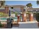Community pool area with barbecue grill, seating, and manicured landscape at 669 Oakmont Ave # 3709, Las Vegas, NV 89109