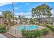 Community pool with surrounding landscaping, seating, and views at 669 Oakmont Ave # 3709, Las Vegas, NV 89109