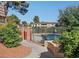 Community pool area with mature trees and attractive landscaping at 669 Oakmont Ave # 3709, Las Vegas, NV 89109