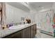 Bathroom featuring granite countertop vanity and glass enclosed shower at 6747 Marjoram St, Las Vegas, NV 89166