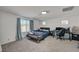 Spacious bedroom with natural light, a futon, and a dedicated workspace at 6747 Marjoram St, Las Vegas, NV 89166