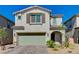 Charming two-story home with a brick driveway, two-car garage, and well-maintained landscaping at 6747 Marjoram St, Las Vegas, NV 89166