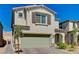 Charming two-story home with a brick driveway, two-car garage, and well-maintained landscaping at 6747 Marjoram St, Las Vegas, NV 89166