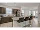 Modern kitchen with granite countertops, stainless steel appliances, and a breakfast bar at 6747 Marjoram St, Las Vegas, NV 89166