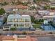 A captivating aerial view of a modern estate with a pool, manicured lawns, and recreational areas at 675 Benedict Dr, Las Vegas, NV 89110