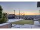 Beautiful backyard featuring a basketball court, a built-in fire pit, and stunning sunset views at 675 Benedict Dr, Las Vegas, NV 89110