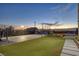 Expansive backyard with basketball court, turf lawn and views of the city at 675 Benedict Dr, Las Vegas, NV 89110