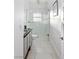Modern bathroom with a glass-enclosed shower, sleek vanity, and light tile flooring at 675 Benedict Dr, Las Vegas, NV 89110