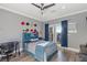 Bedroom featuring grey walls, an adjacent desk, and a sliding glass door with blue curtains at 675 Benedict Dr, Las Vegas, NV 89110