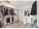 Walk-in closet featuring custom shelving, hanging rods, and a built-in vanity area at 675 Benedict Dr, Las Vegas, NV 89110