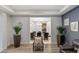 Formal dining room showcases modern decor, stylish seating, and views into additional living spaces at 675 Benedict Dr, Las Vegas, NV 89110