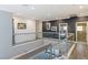 Bright upstairs hallway features glass railings and wood floors at 675 Benedict Dr, Las Vegas, NV 89110