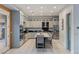 Well-lit kitchen features stainless steel appliances, grey cabinetry, and a center island with seating at 675 Benedict Dr, Las Vegas, NV 89110