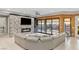 Contemporary living room with built-in fireplace, sleek furniture, and views of the outdoor living area at 675 Benedict Dr, Las Vegas, NV 89110
