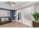 Stylish living room with contemporary furnishings, wood-look floors, natural light, and a view to foyer at 675 Benedict Dr, Las Vegas, NV 89110