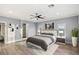 Main bedroom features modern decor, wood-look floors, recessed lighting, and neutral walls at 675 Benedict Dr, Las Vegas, NV 89110