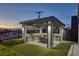 Outdoor kitchen featuring a built-in grill, countertops, and dining area at 675 Benedict Dr, Las Vegas, NV 89110