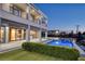 Inviting backyard features a sparkling in-ground pool and a modern two-story home at 675 Benedict Dr, Las Vegas, NV 89110
