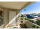 Exterior entrance to unit features secure door, textured walls, and desert landscaping at 6800 E Lake Mead Blvd # 1034, Las Vegas, NV 89156
