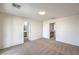 Carpeted bedroom offers two entry points into the bathroom and hall area at 6856 Pipil St, Las Vegas, NV 89166
