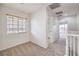 Hallway bedroom features a window for natural lighting and a view of the hall at 6856 Pipil St, Las Vegas, NV 89166
