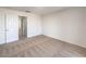 This bedroom boasts neutral carpet, white walls, and a door to the hallway at 6856 Pipil St, Las Vegas, NV 89166
