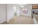 Well-lit dining area with tile floors, stainless steel appliances, and convenient access to the laundry room at 6856 Pipil St, Las Vegas, NV 89166