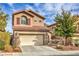 Inviting two-story home with a two-car garage and tasteful landscaping at 6856 Pipil St, Las Vegas, NV 89166