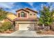 Charming two-story home with a tile roof, desert landscaping, and an attached two-car garage at 6856 Pipil St, Las Vegas, NV 89166