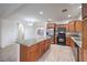 Bright kitchen features a large island with granite countertops and modern stainless steel appliances at 6856 Pipil St, Las Vegas, NV 89166