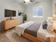 Cozy bedroom featuring a platform bed, soft rug, and neutral tones for a calming atmosphere at 6983 Positano Hill Ave, Las Vegas, NV 89178