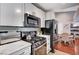 Modern kitchen featuring marble countertops, stainless steel appliances, and modern cabinets at 7885 W Flamingo Rd # 2023, Las Vegas, NV 89147