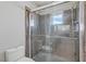 Stylish bathroom with tiled shower and glass doors at 7973 Macklin St, Las Vegas, NV 89129
