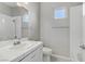 Bathroom featuring a toilet, sink, and tiled shower at 7973 Macklin St, Las Vegas, NV 89129