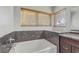 Relaxing bathroom with soaking tub and granite surround at 7973 Macklin St, Las Vegas, NV 89129
