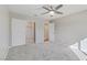 Bedroom features ceiling fan, carpet, and closet with sliding doors at 7973 Macklin St, Las Vegas, NV 89129